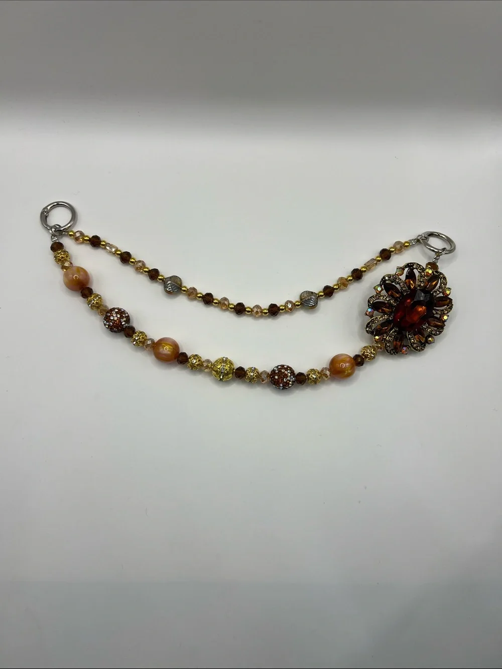 745. Vintage-Inspired Amber Beaded Bag Chain with Floral Accent